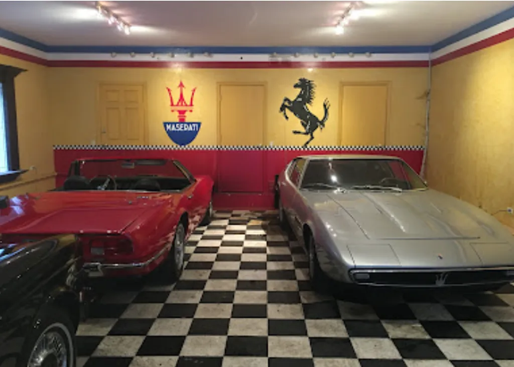 Professional auto detailer working on luxury vehicle interior